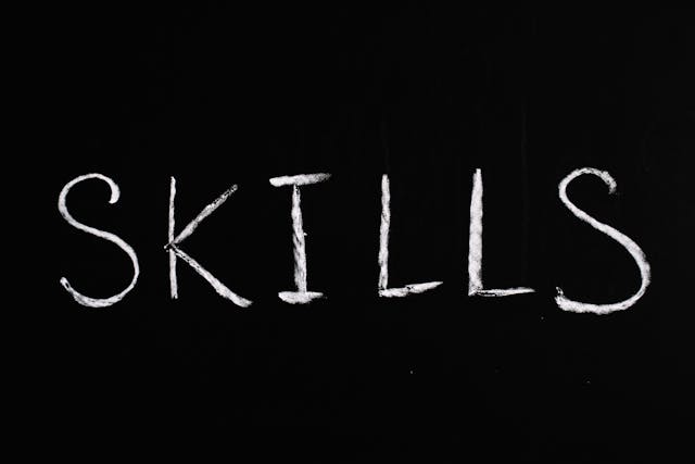 Word 'SKILLS' written in black bg with white chalk, smbolising tips to improve cybersecurity skills